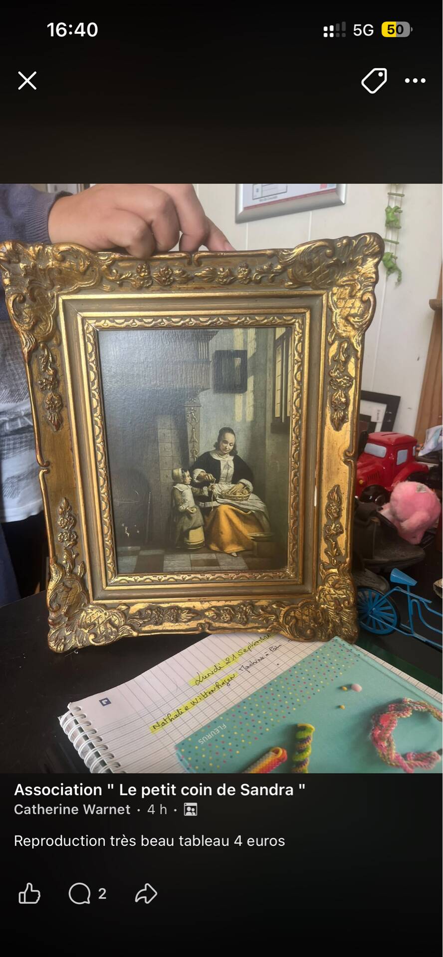Framed reproduction painting with a golden frame.