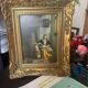 Framed reproduction painting with a golden frame.