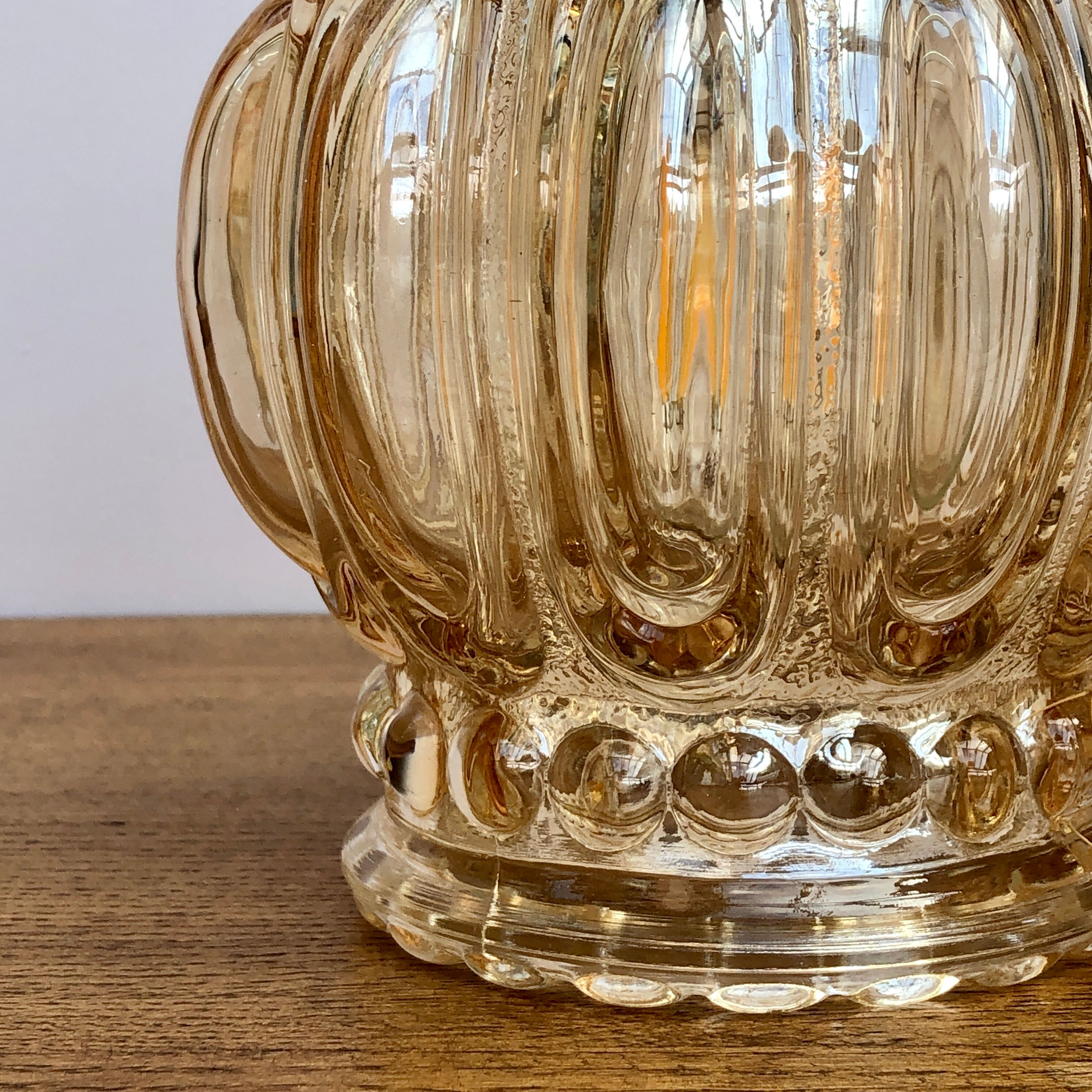 Vintage amber glass globe hand lamp