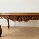 Oval coffee table in Louis XV style made of onyx and solid wood.
