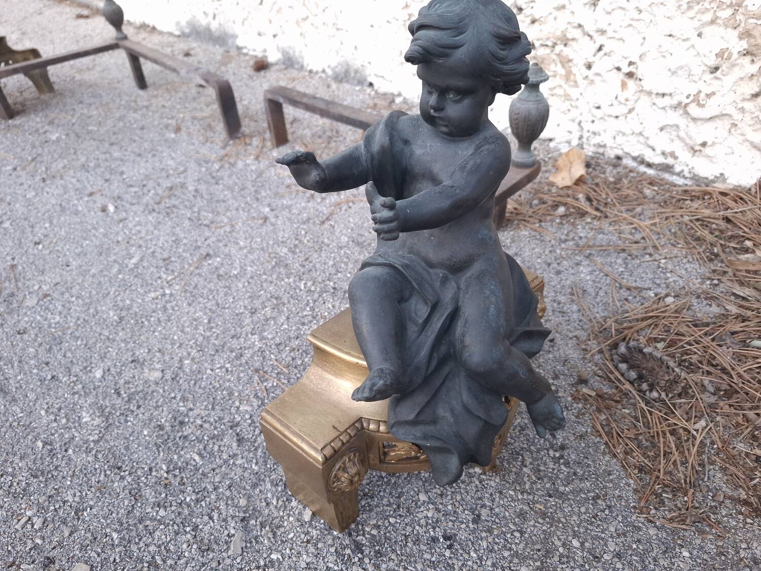 XIXth-century andirons decorated with cherubs and angels