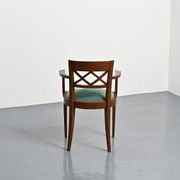 Set of four Art Deco armchairs in wood, France, circa 1940.