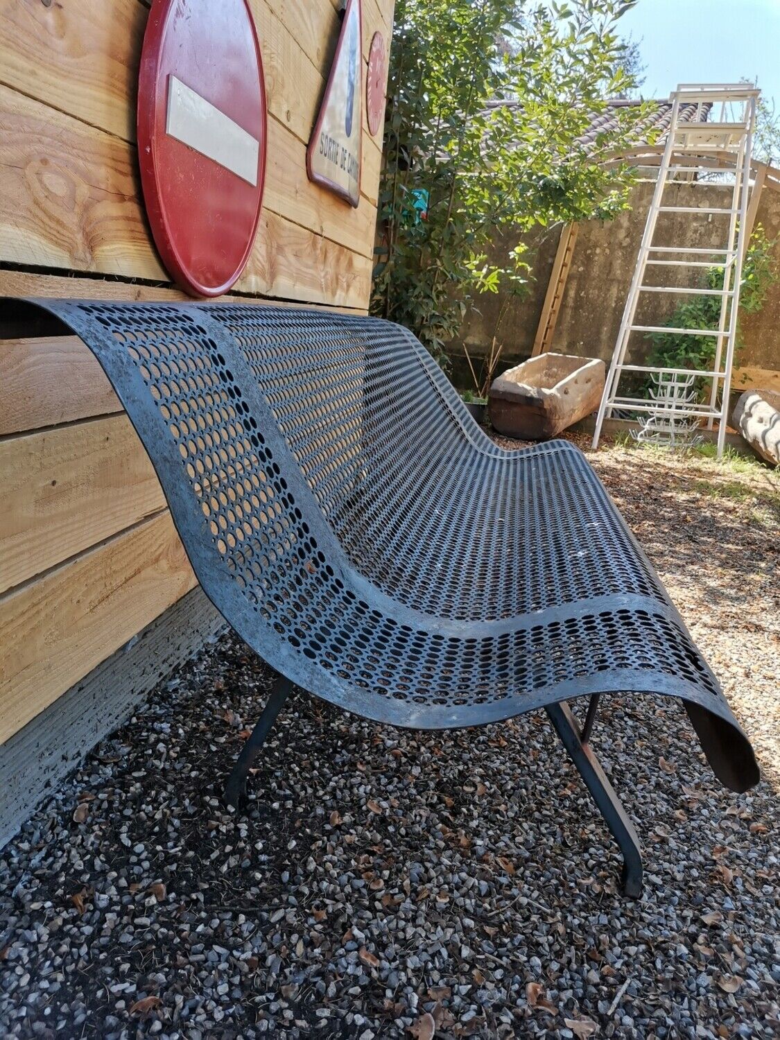 Former garden bench in perforated sheet metal