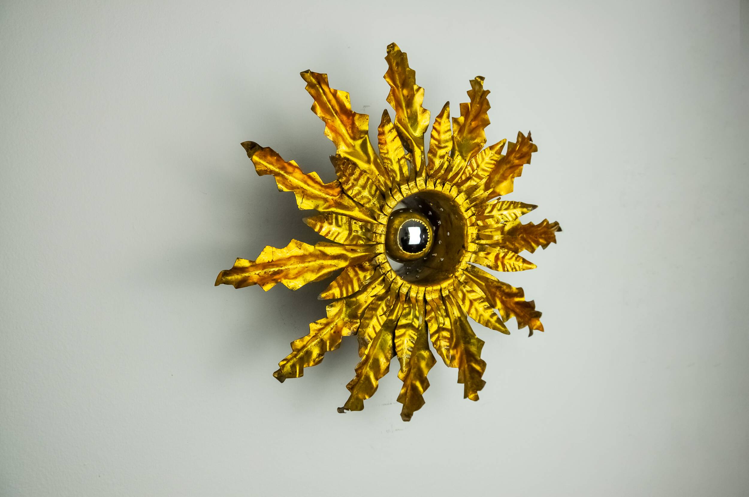 Brutalist sun wall lamp, metal and gold leaf, Italy, 1960