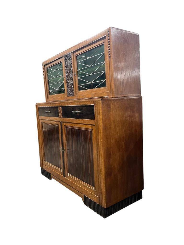 Vintage Art Deco display cabinet in wood with green stained glass.