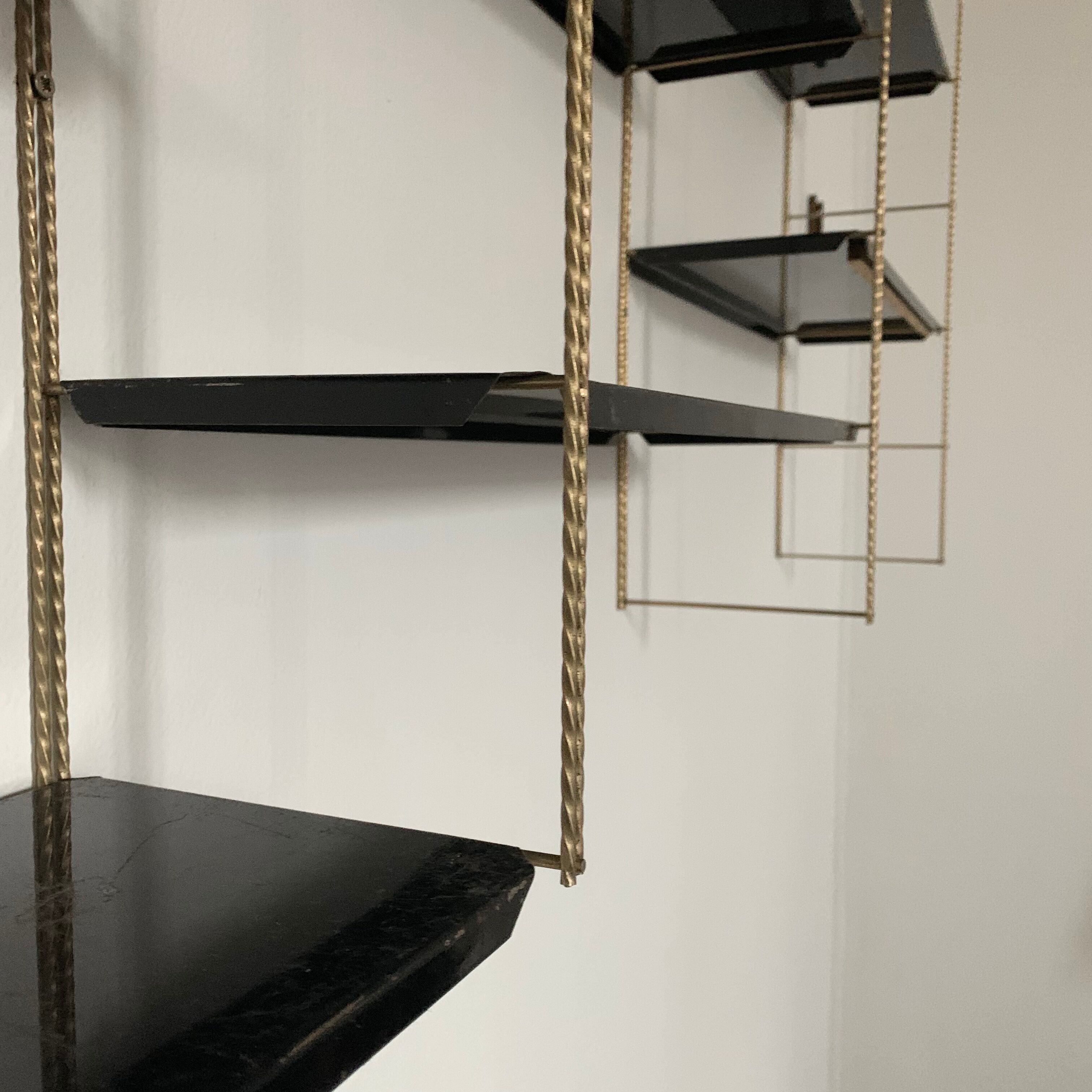 Vintage wall shelves in gold and black metal
