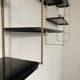 Vintage wall shelves in gold and black metal