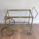 Brass rolling table with removable double trays from Maison Jansen.
