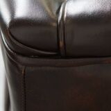 Comfortable wingback chair in English style made of cowhide leather