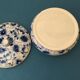 Porcelain candy dish. Blue flower patterns on white background
