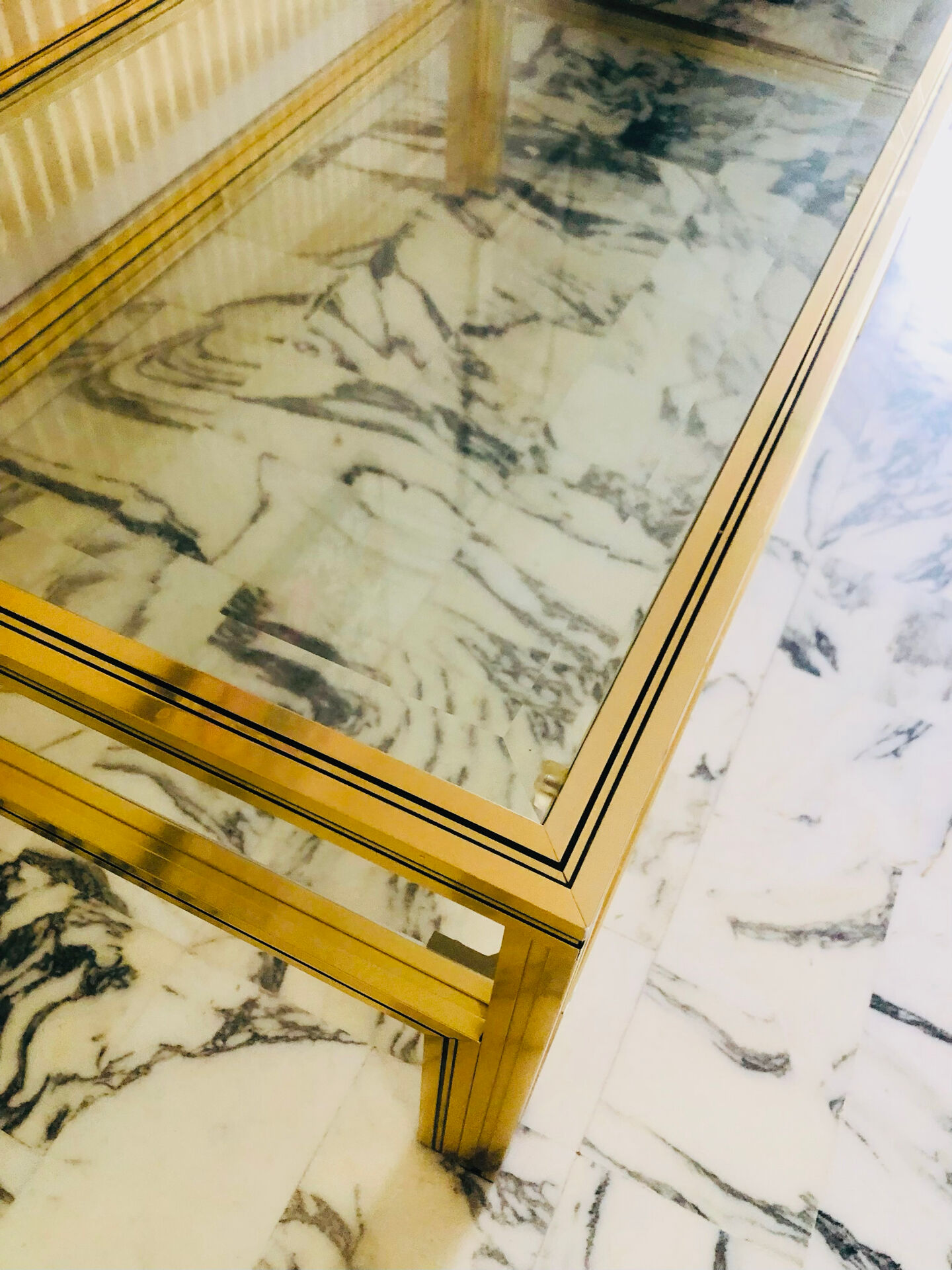 Coffee table with 2 brass and glass tops signed Pierre Vandel Paris, circa 70s.