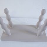 Small vintage wooden bench renovated in pinkish beige
