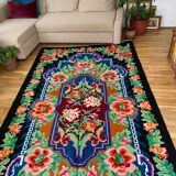 Rug with floral design on a blue background made by hand in Romania