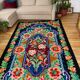 Rug with floral design on a blue background made by hand in Romania