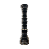 A brutalist black pepper mill