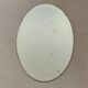 Old bevelled stitched oval mirror