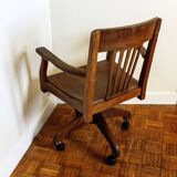 Oak wood office chair with swivel seat and swivel wheels