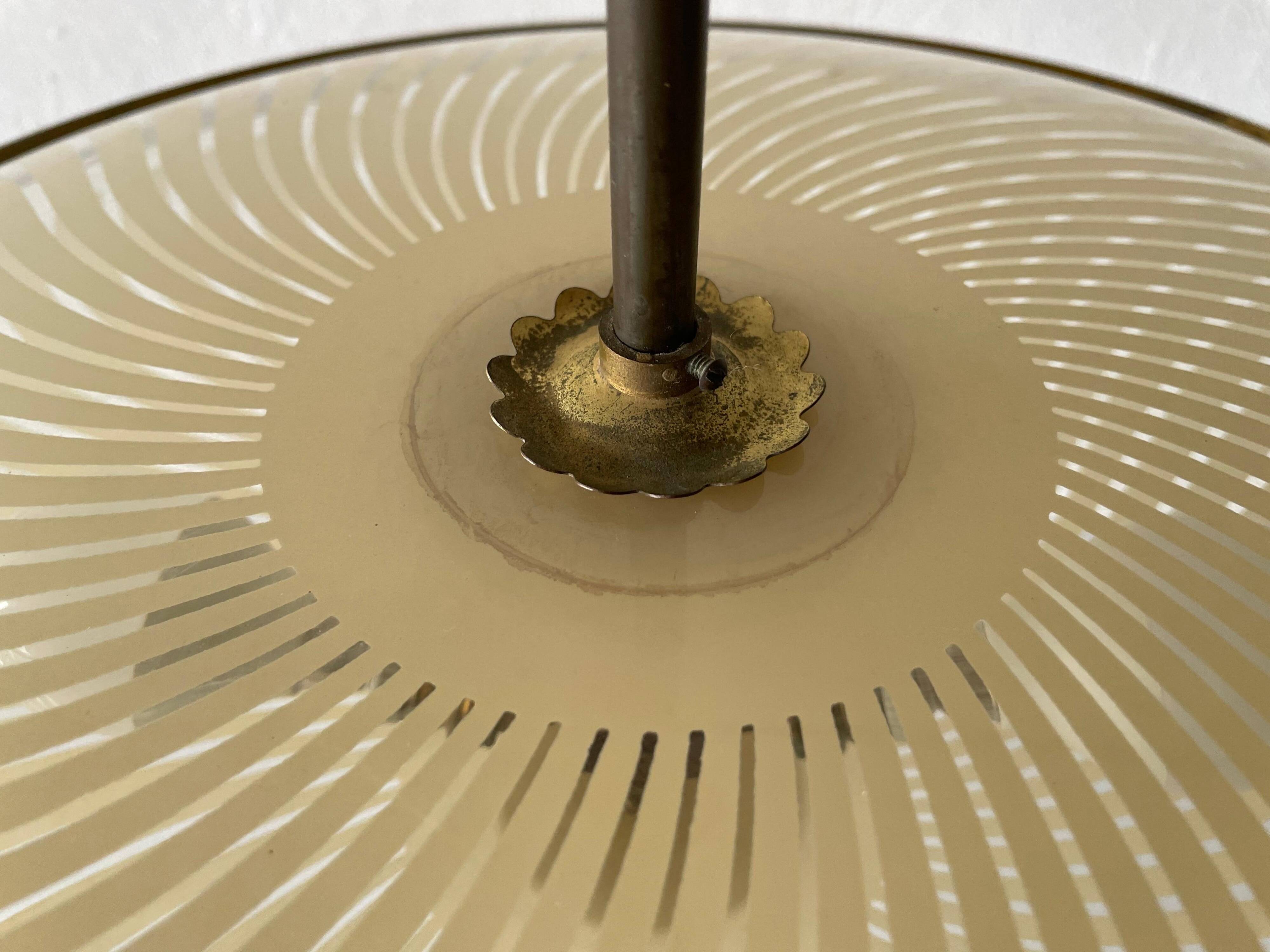 Large UFO design ceiling light in brass and printed glass, 1950s, Italy.