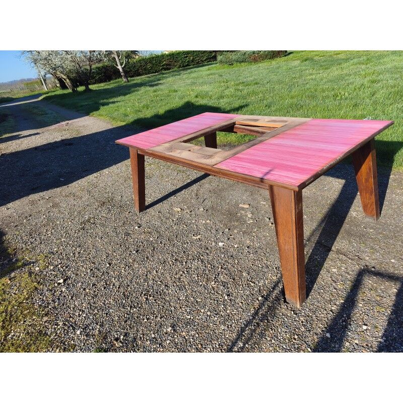 1960s oak dining table with integrated extensions.