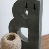 Letter of sign in zinc