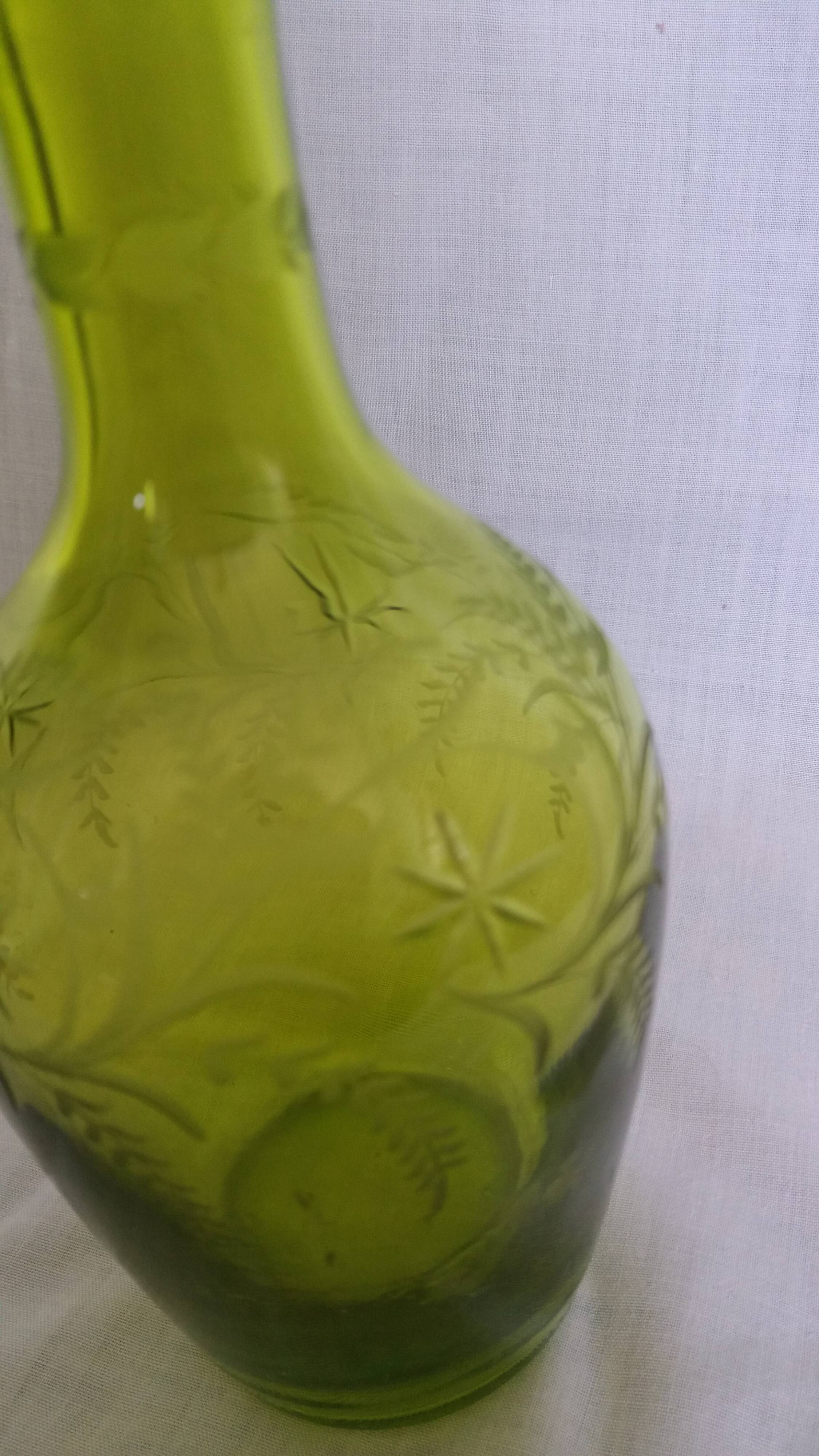 Cut and engraved green blown glass carafe vase