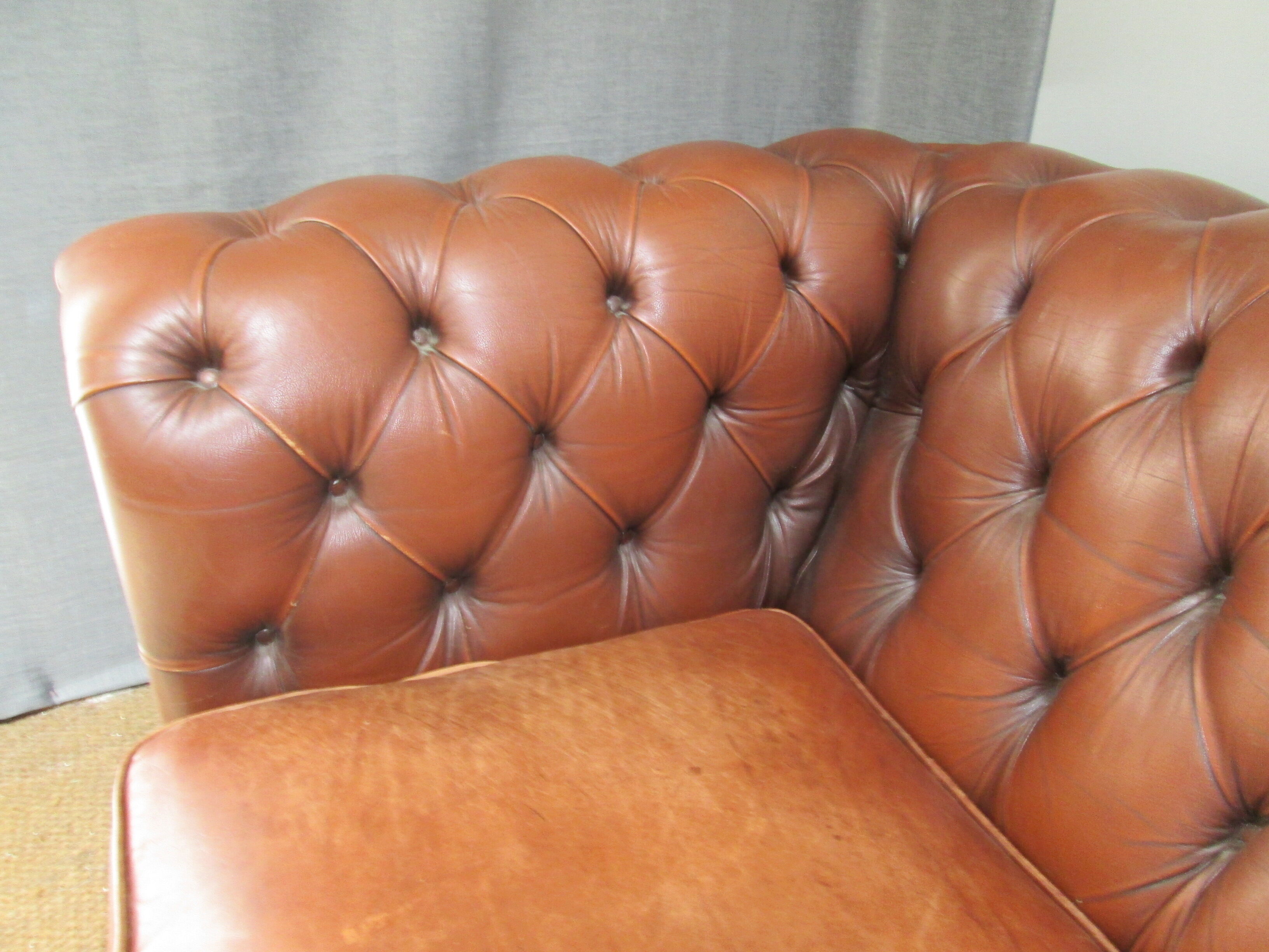 Brown leather chesterfield sofa