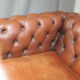 Brown leather chesterfield sofa