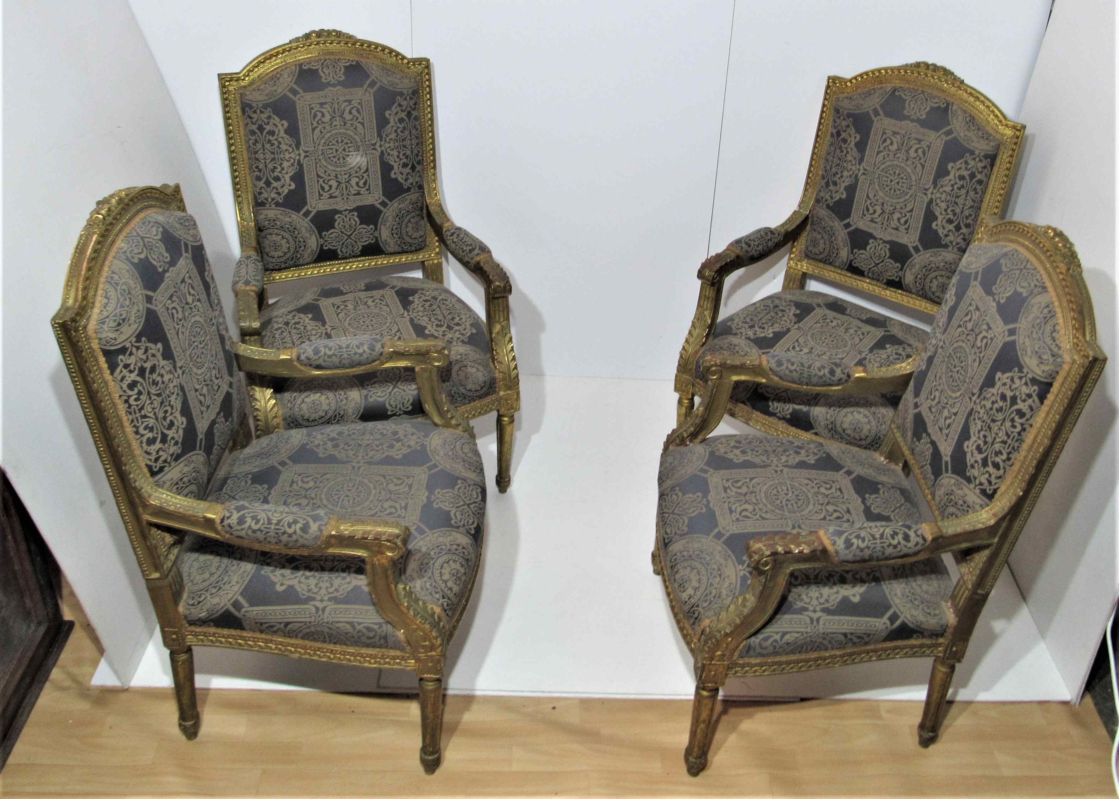 4 armchairs and a gilded wooden sofa Louis XVI style