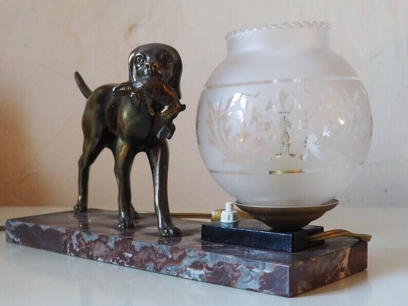 French Art Deco hunting dog on a marble base with a switched lamp.