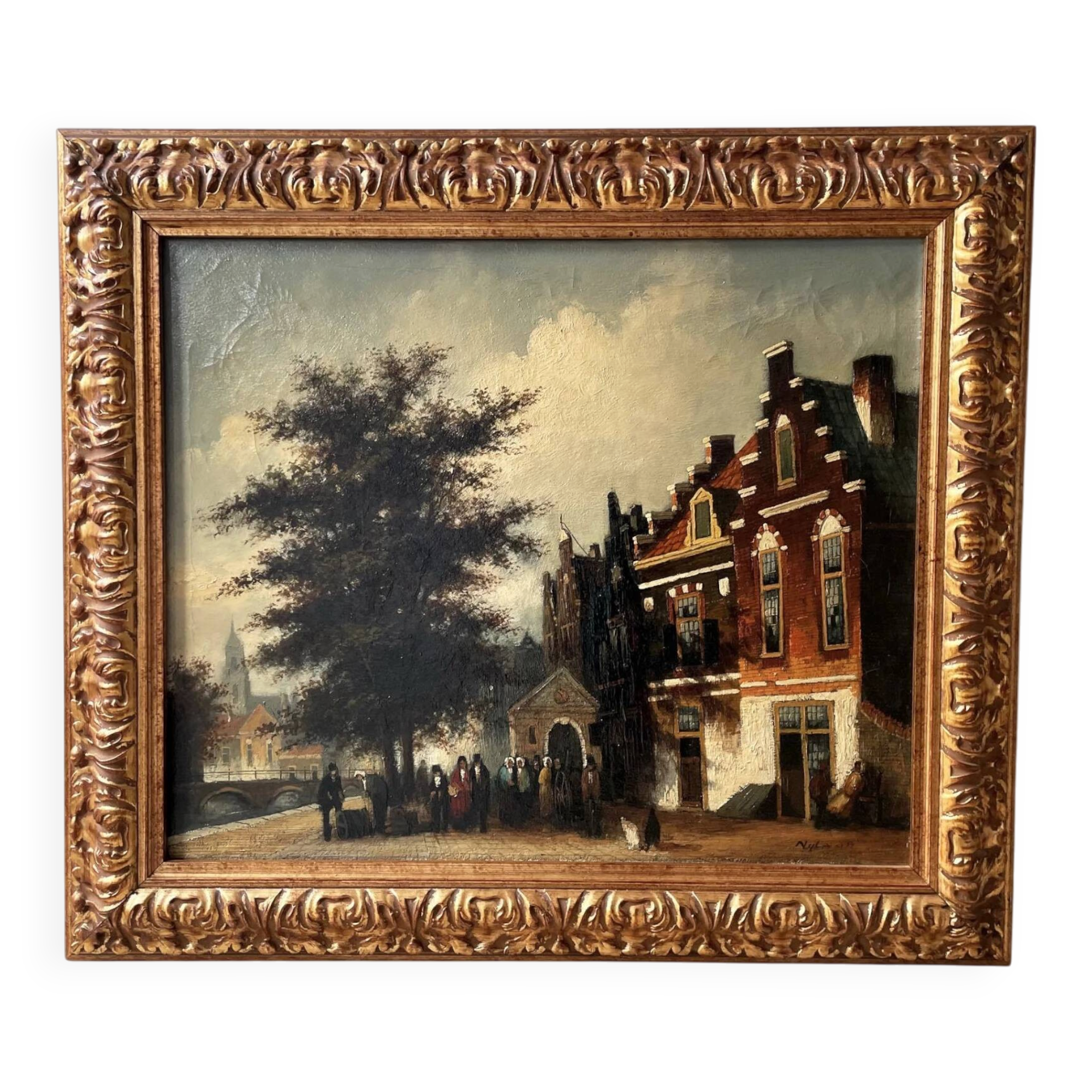 Dutch street scene oil painting in ornate frame signed Nijland