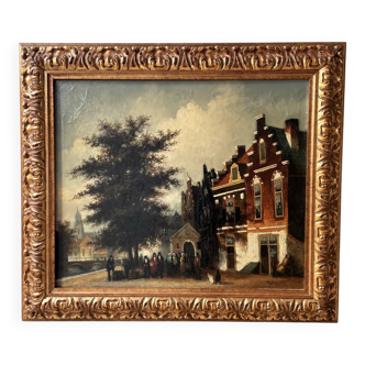 Dutch street scene oil painting in ornate frame signed Nijland