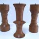 Three vintage patinated solid wood candlesticks