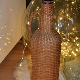 Braided rattan/wicker bottle