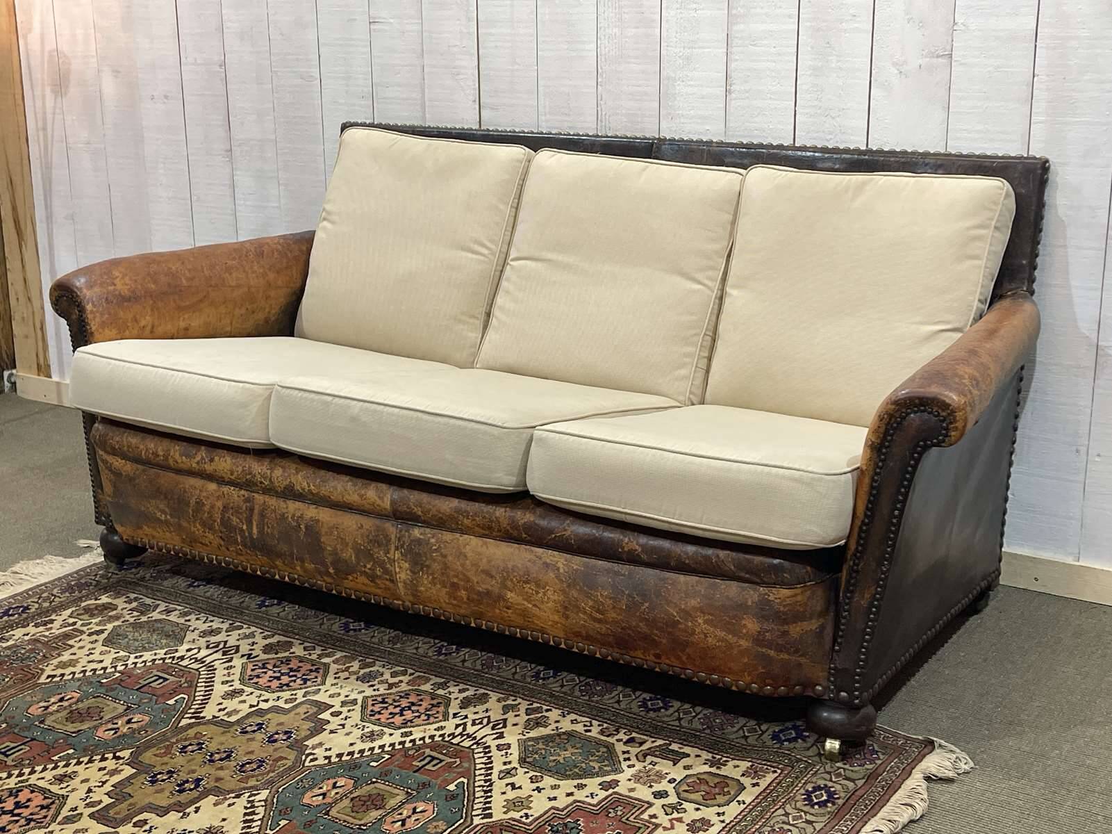 Early 20th century leather club sofa - seat and back in modern fabric