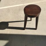 Small high tripod stool in brown solid wood