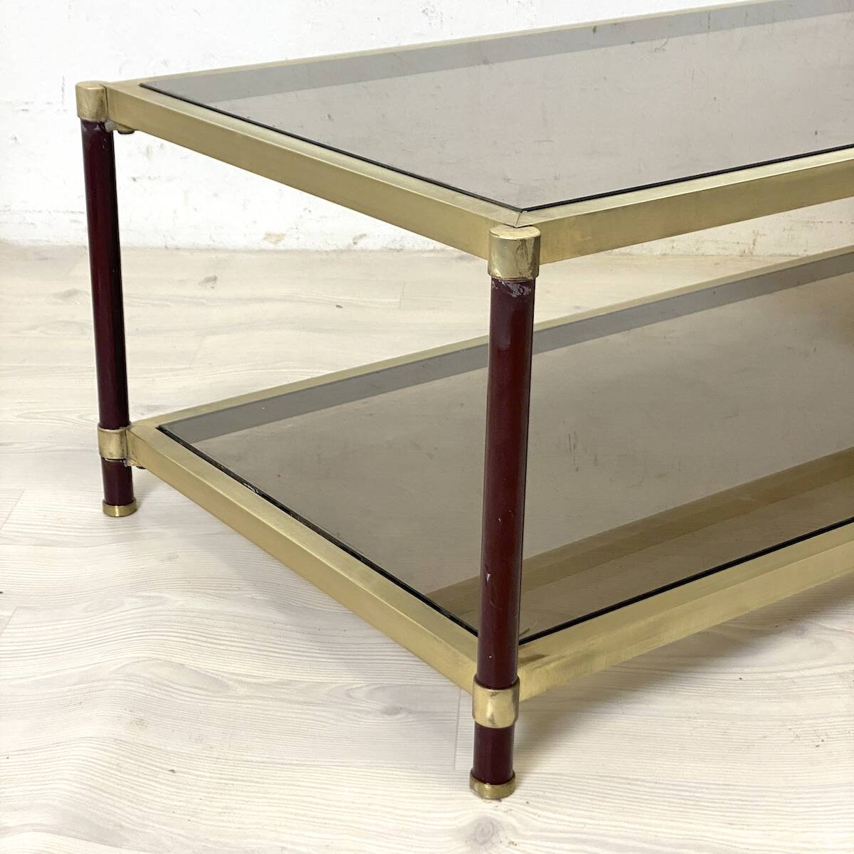 Vintage 1970s gold metal and smoked glass coffee table.