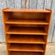 Vintage oak bookcase with compass base