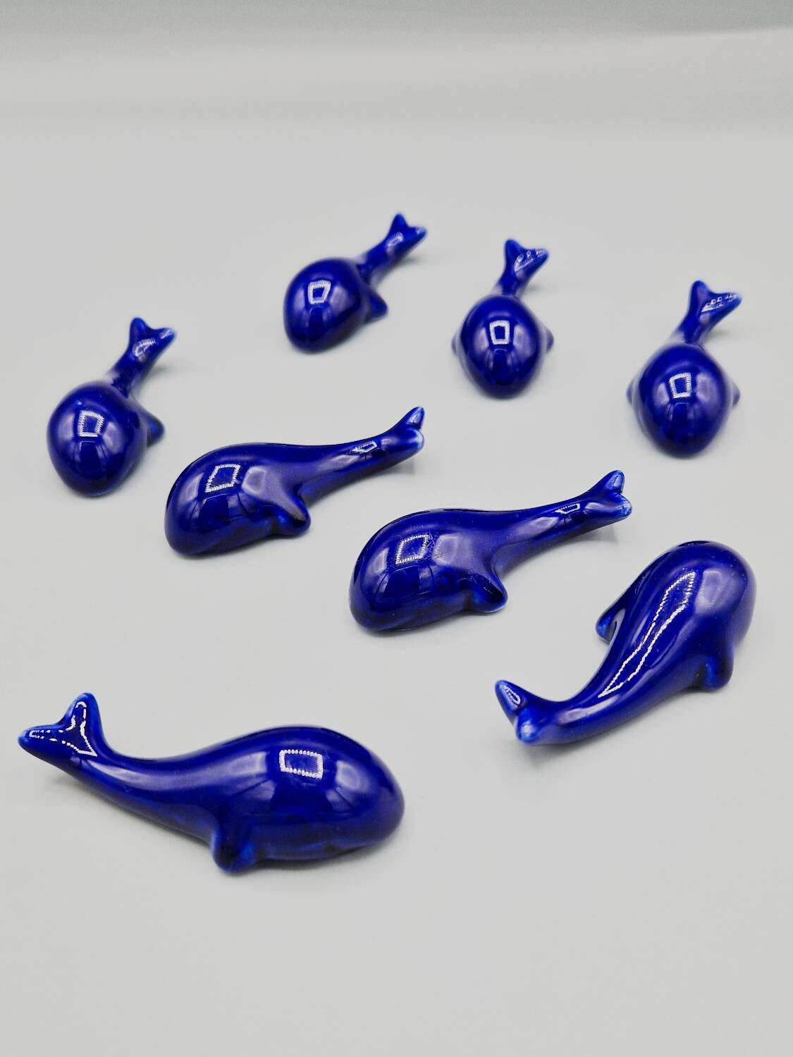 Set of 6 vintage blue porcelain whale knife rests.