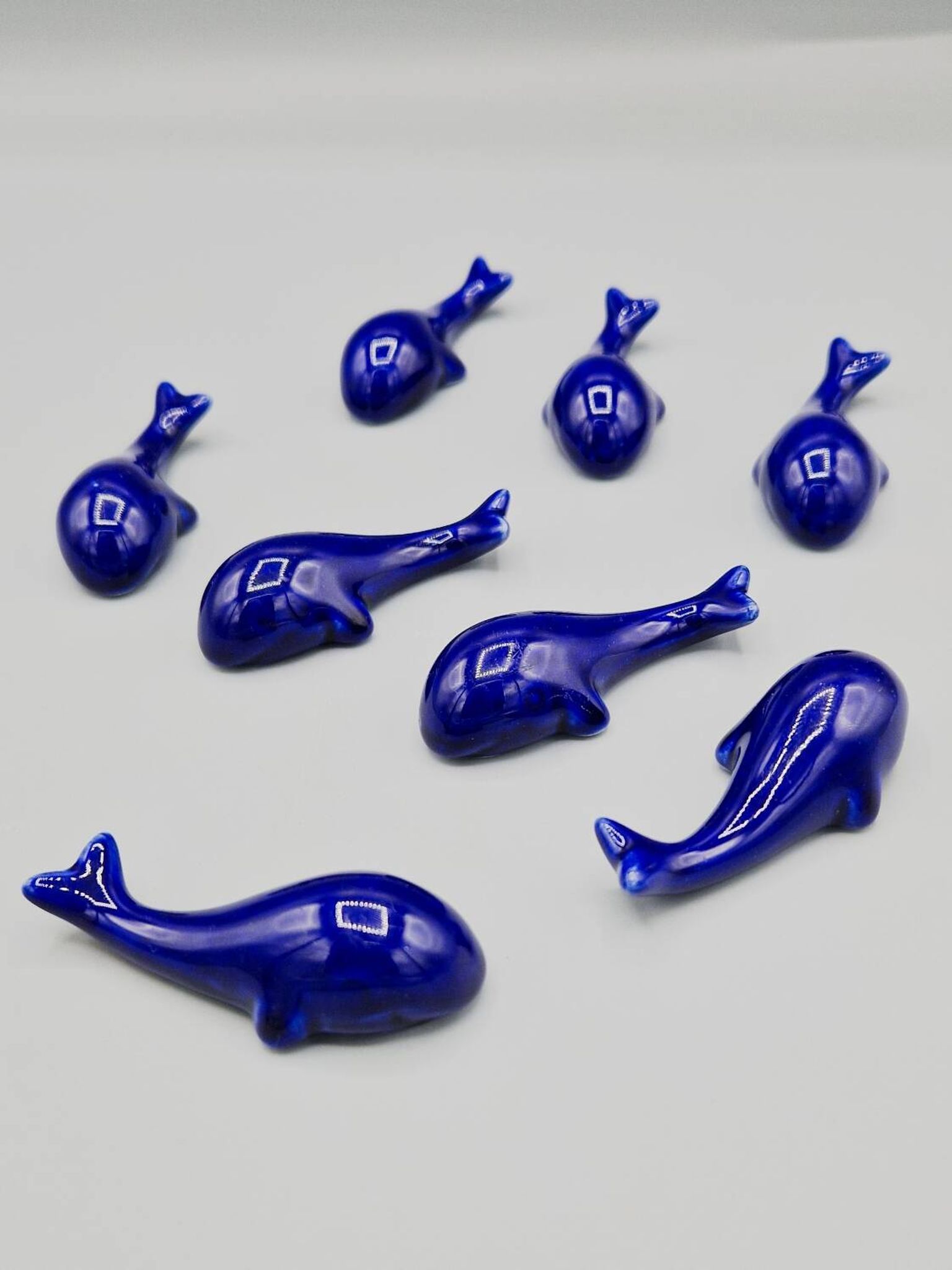 Set of 6 vintage blue porcelain whale knife rests.