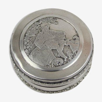 Small round box with silver pills