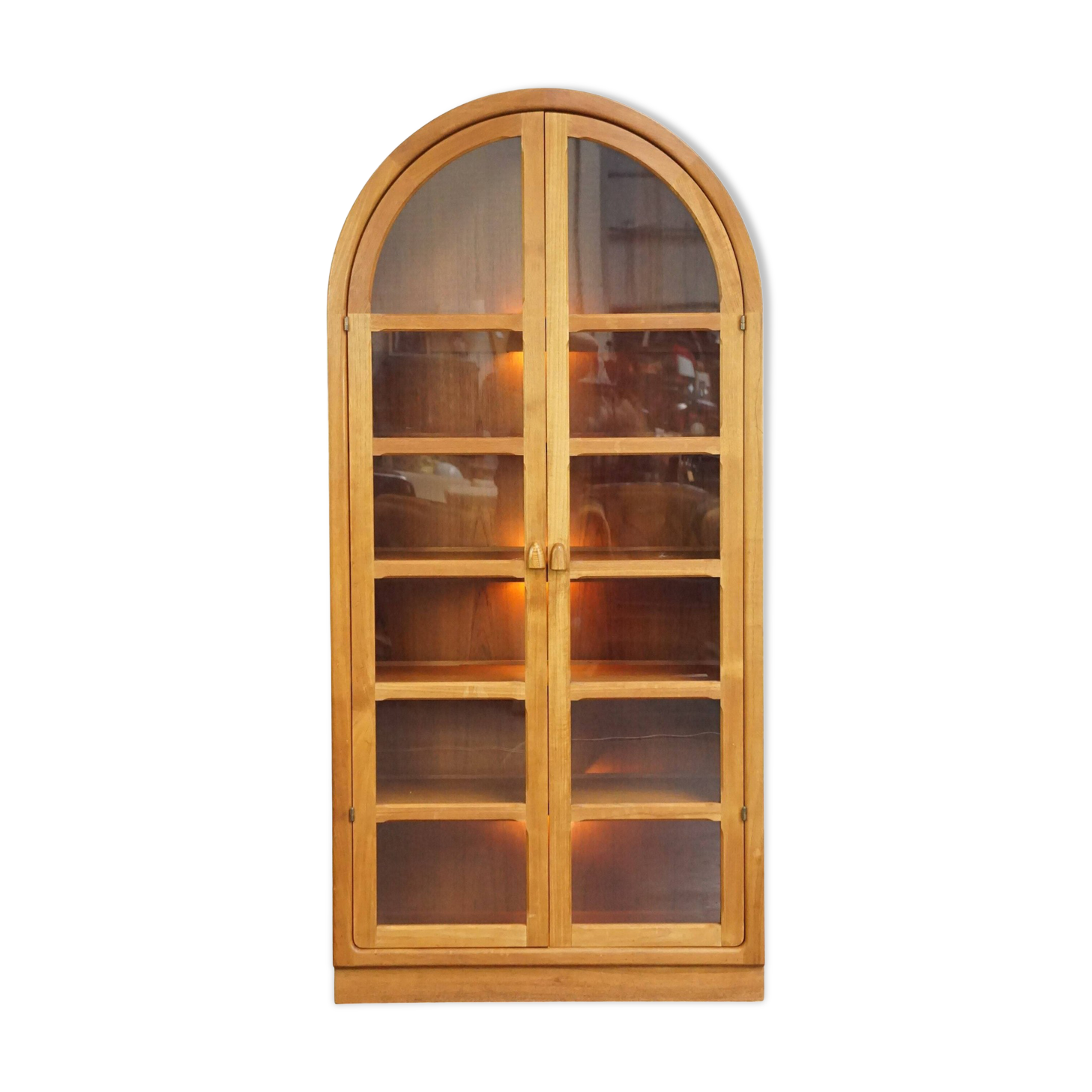 Elegant vintage Danish display cabinet with glass panels and atmospheric lighting