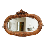 Beveled mirror in carved wood