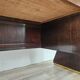 Art Deco executive desk in exotic wood, glass, and brass.