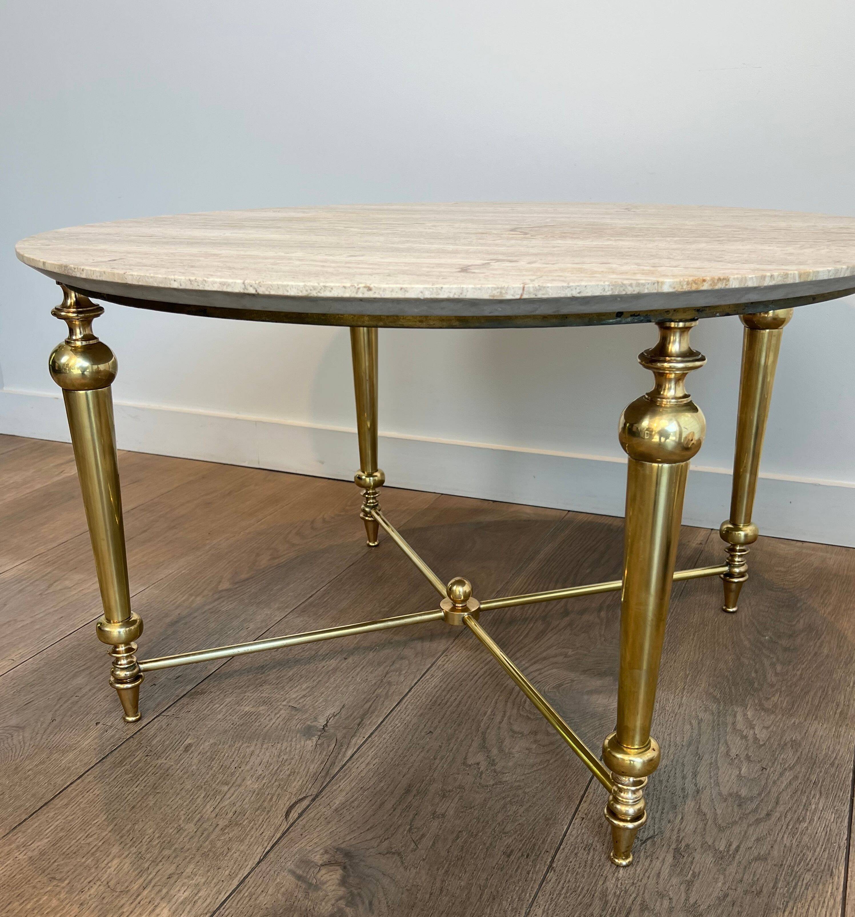 Brass coffee table with a white marble top.