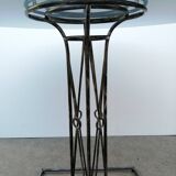 Wrought iron dining table with its round smoked glass top, vintage 1980