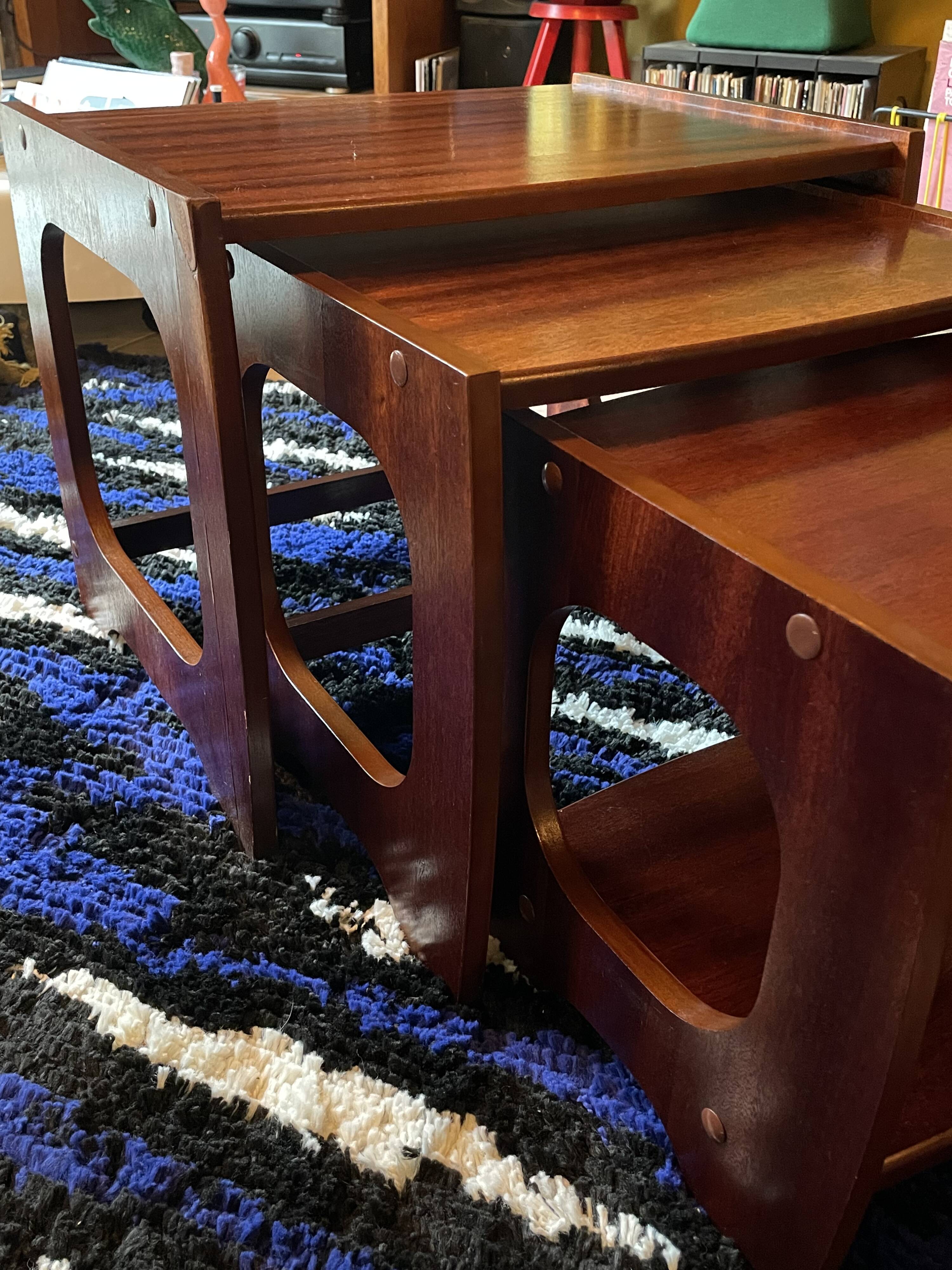 Set of three nesting coffee tables, 1970, dark wood.