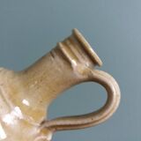 Bottle with handle, pitcher, in stoneware, signed