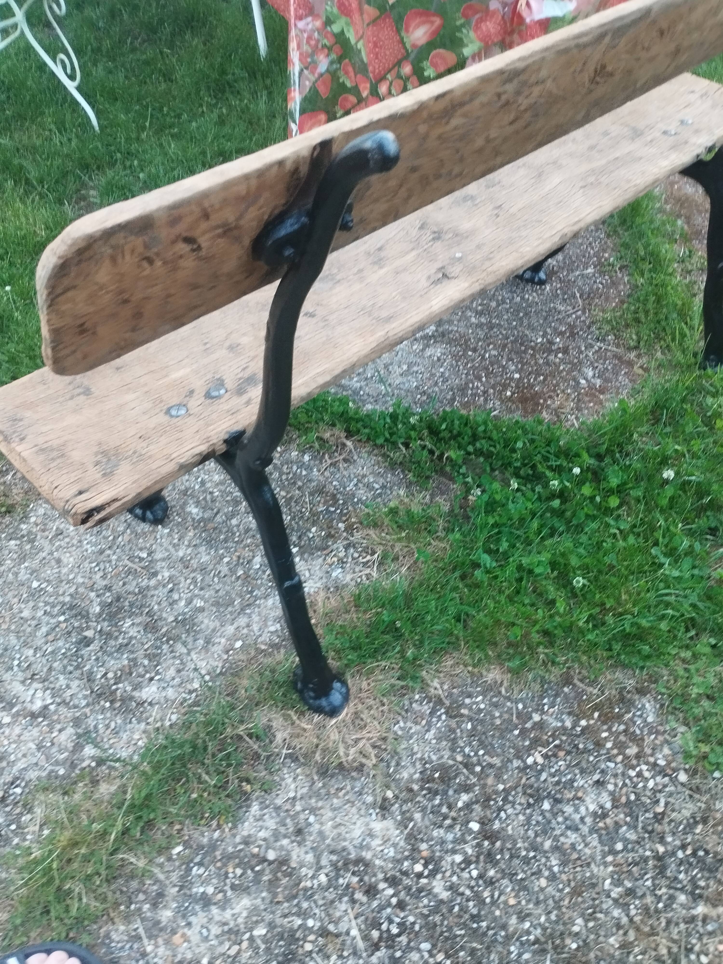 Antique garden bench with cast iron legs