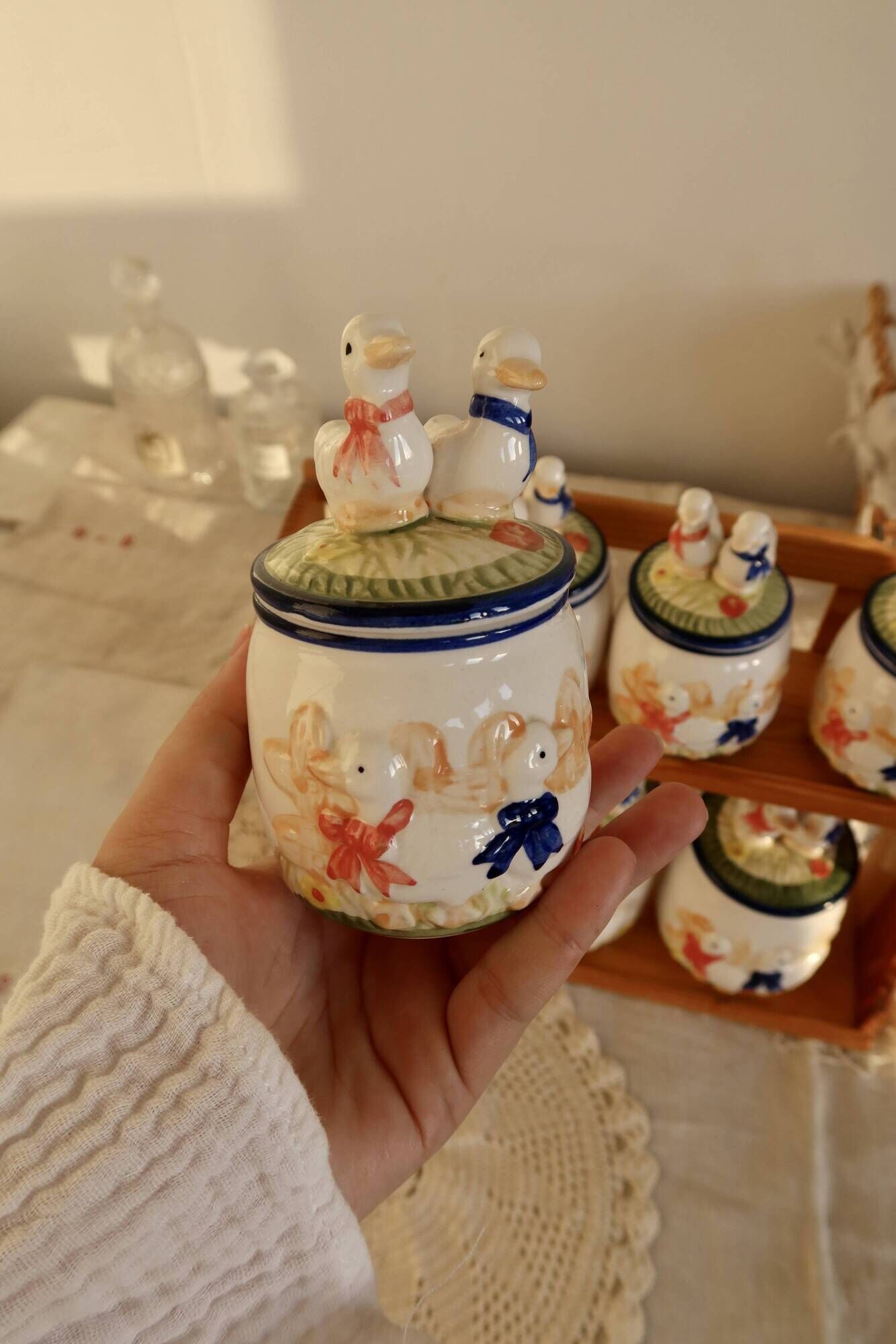 Vintage wooden wall condiment shelf and porcelain pots with geese slip pattern