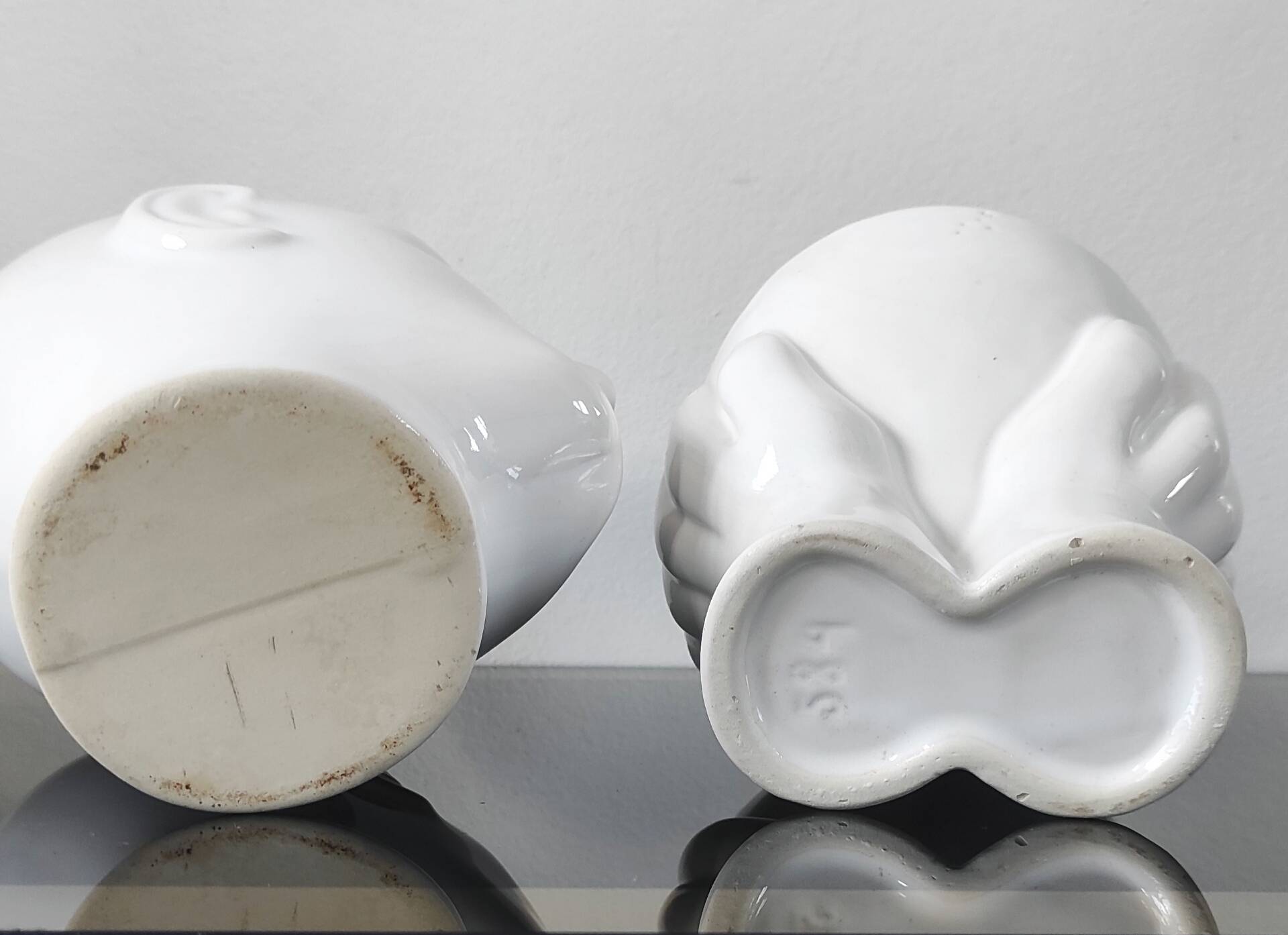 A pair of vintage ceramic plant pots.